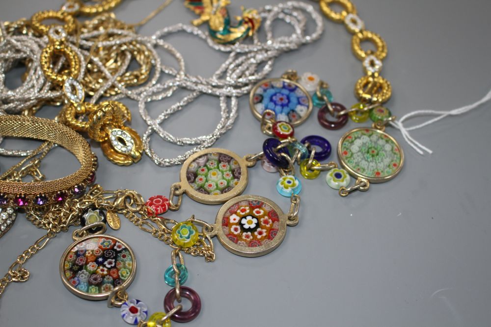 Seven assorted costume necklaces including a millefiore glass necklace, a costume bird brooch and bracelet with coloured paste stone